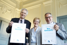 Three people holding Blue Planet Project cerificates