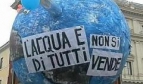 Model of the earth with slogans in Italian