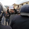 A protestor holding a placard telling President Abdelaziz Bouteflika to step out of the way at a demonstration held in Bejaia on 5 April 2014 to call for a boycott of the Algerian presidential election. (AP Photo/Sidali Djarboub)
