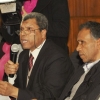 Mansour Cherni, left, takes the floor